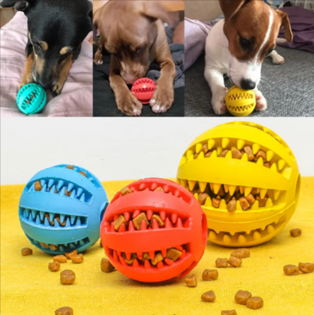 Rubber treat-dispensing puzzle dog balls in blue, red, and yellow colors