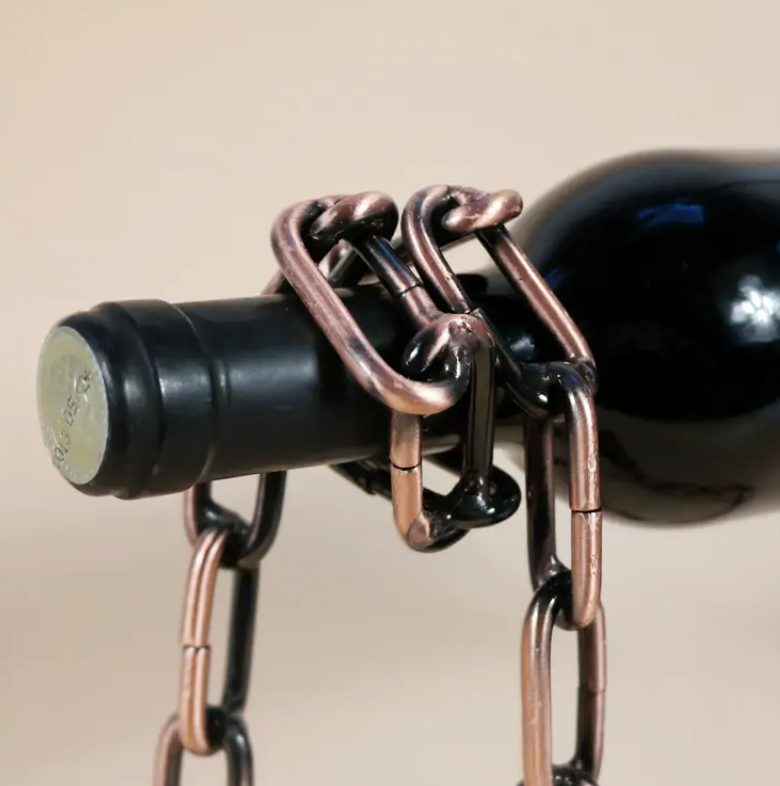 Wine bottle chain holder close-up with copper-toned chain around bottle neck