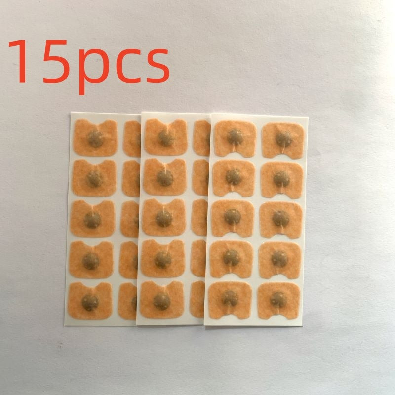Close-up of beige square nose patches with dark centers arranged on backing