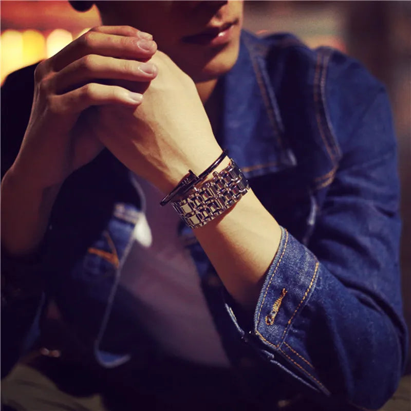 Unisex LED electronic watch showing a red illuminated digital display on dark strap