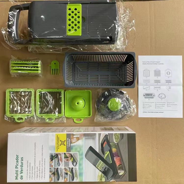 Vegetable chopper and dicer contents in box with trays, blade pieces, and manual