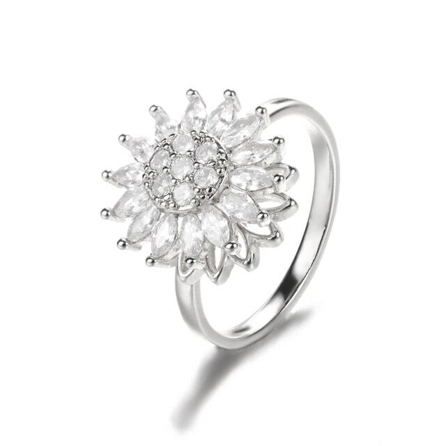 Silver sunflower fidget ring with crystal center and rotating petal spinner
