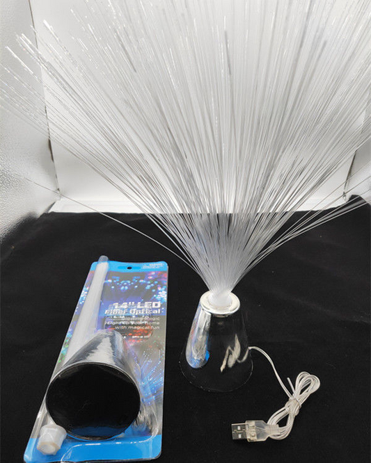 Fiber optic colour-changing lamp with clear crystal top, chrome base, and white fiber strands