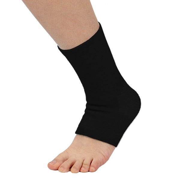 Black ankle support sock on foot, elastic compression band at ankle
