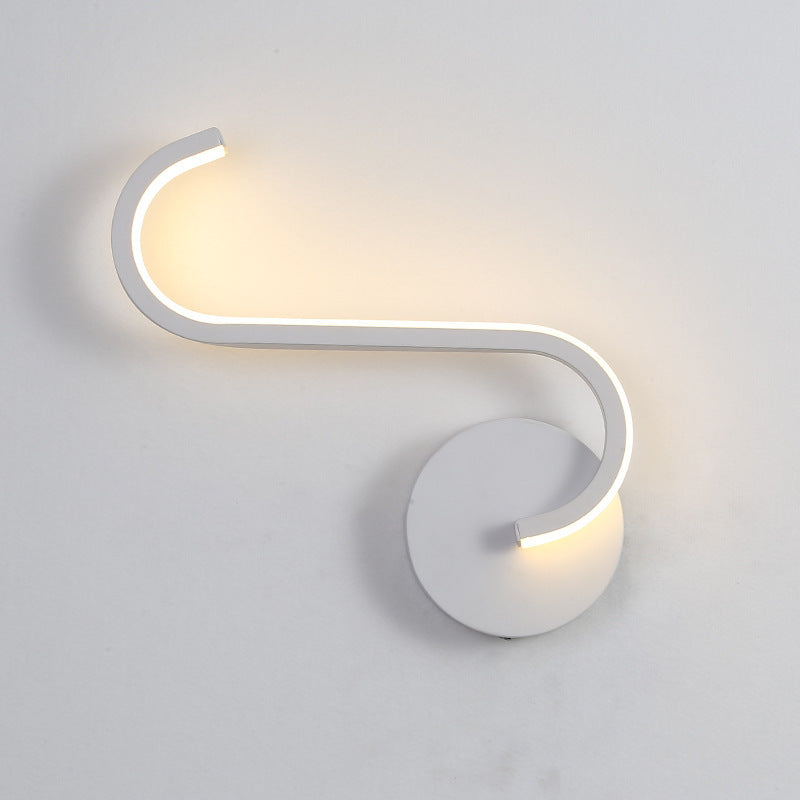 White LED wall lamp with circular backplate and bent C-shaped light