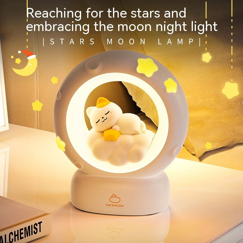 Beige moon night light lamp with sleeping kitten in glowing circular ring on base