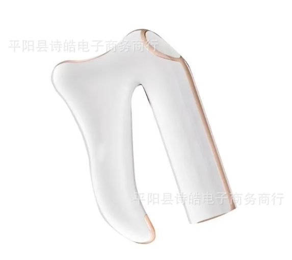 White electric gua sha massager head, smooth curved contact area with gold-toned side