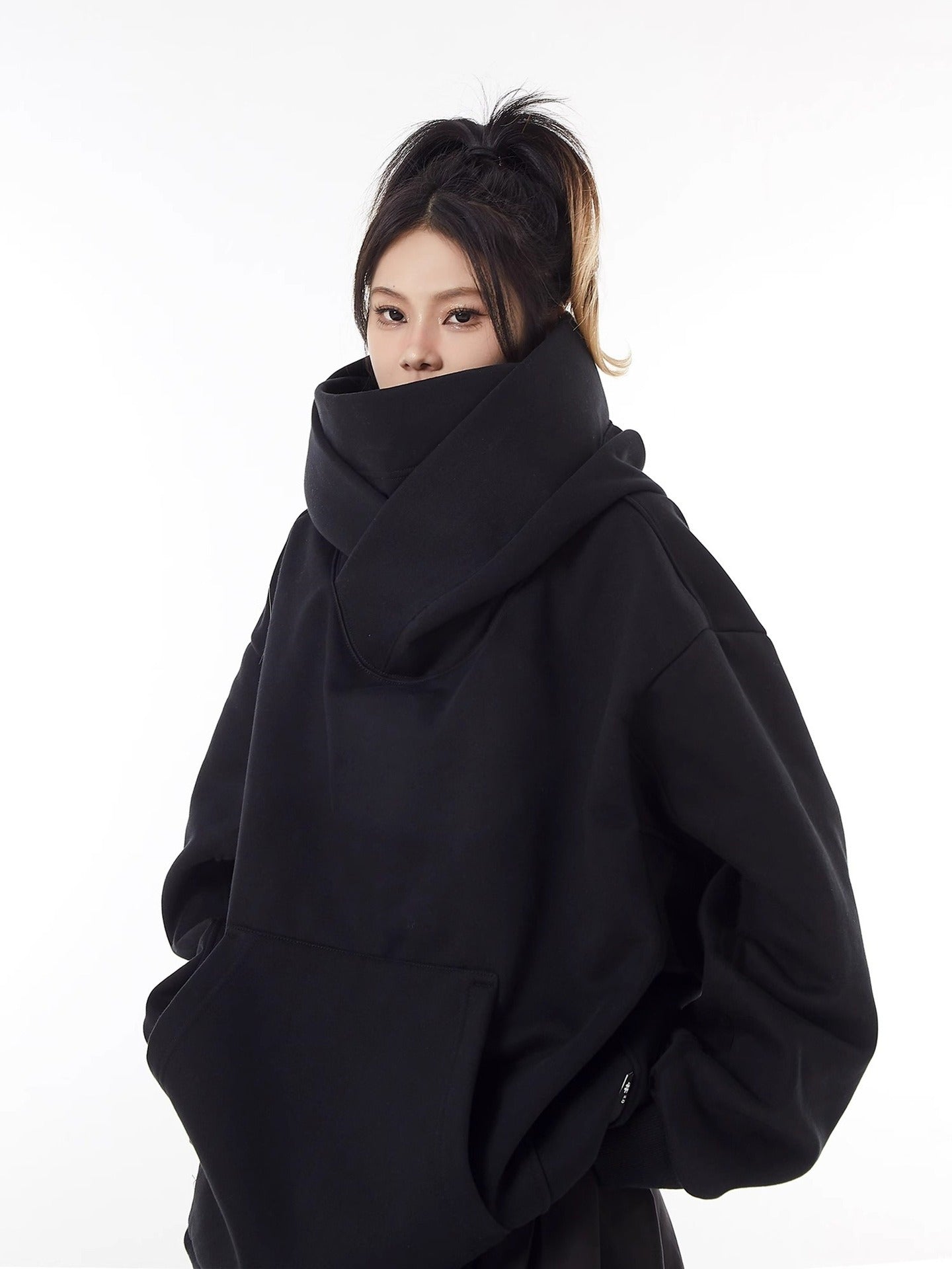 Black high-collar fleece-lined hoodie with kangaroo pocket and roomy sleeves