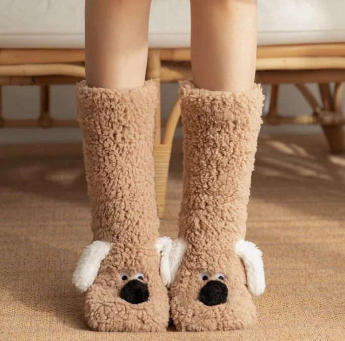 Women’s plush dog socks in tan with white paw accents and a black nose