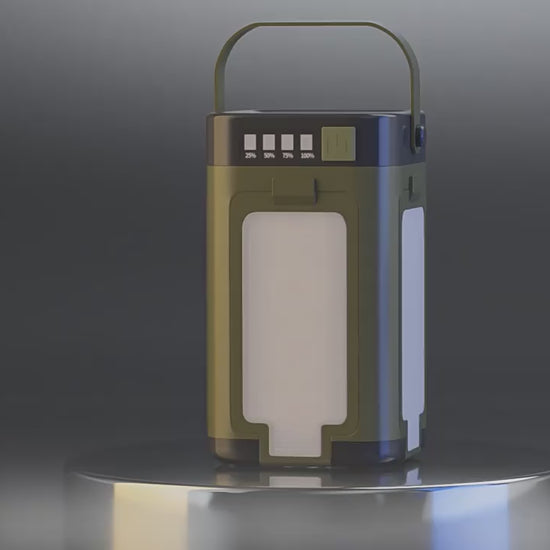 Green lantern with a handle, illuminated display, on a reflective surface, against a gray backdrop.