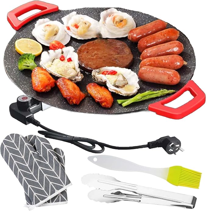 Round electric non-stick baking tray with red handles, cooktop with sausages and seafood